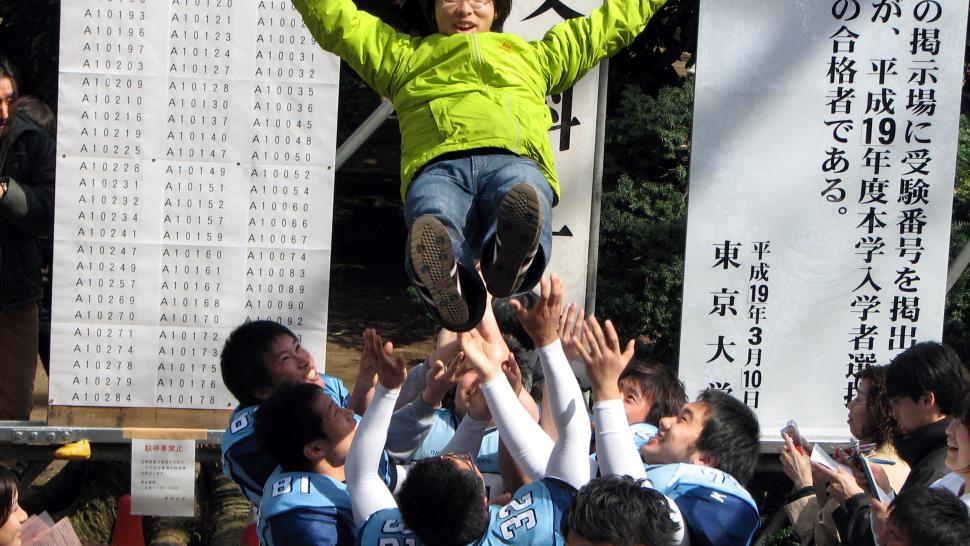 Students celebrate passing their entrance exams to the prestigious Tokyo University.